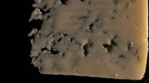 Blue cheese rotating on black background, top view Stock Footage 291954855