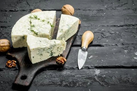 Blue cheese with walnuts. Stock Photos