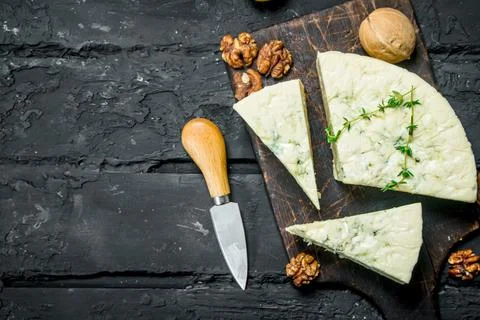 Blue cheese with walnuts. Stock Photos
