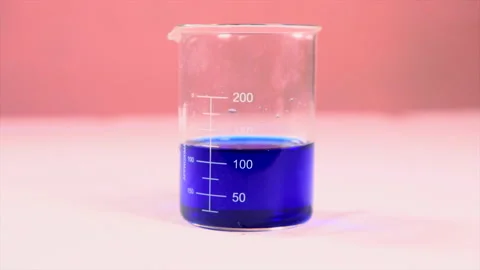 Blue chemical in a beaker. Stock Footage 246956512