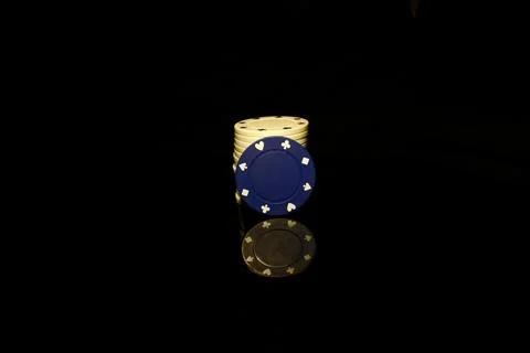 Blue chips stack with a White chip in front isolated on black with reflection Stock Photos