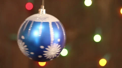 Blue Christmas ball on the background blinking blurred garland. Stock Footage 66361198