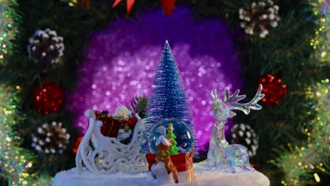 A blue Christmas tree surrounded by Christmas figures Stock Footage 280960796