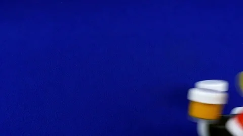 Blue chromakey jars of paint fall on smooth background slow motion . 库存影片 84498978