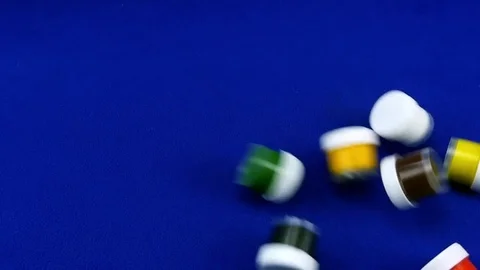 Blue chromakey slow motion jars of paint fall on smooth background. 库存影片 84498672