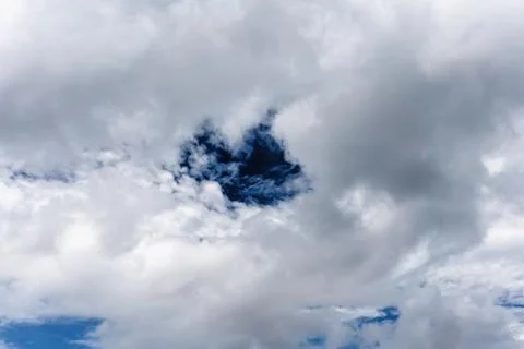 Blue Circle In The Clouds Stock Photos
