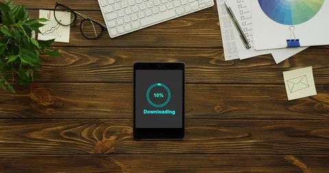 Blue circle of percents loading in the black screen of the black tablet computer Stock Footage 95055692