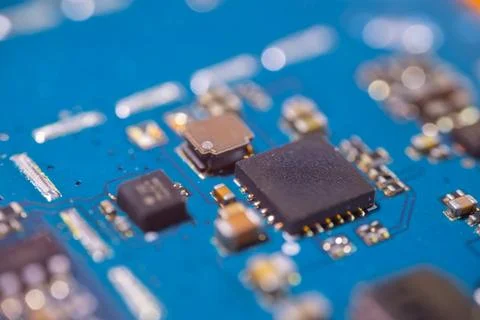 Blue circuit board with integrated chips, soldered electronic components, m.. Stock-Fotos