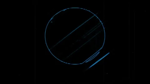 Blue circular pattern with diagonal lines on a black background 库存影片 283768311