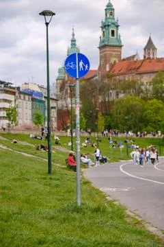 Blue circular sign designating a shared bicycle and pedestrian path in a city Stock Photos