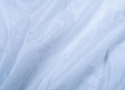 Blue clean sheet, close up view. Smooth blue textile, an abstract background Stock Photos