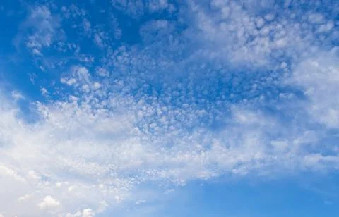 Blue clean sky with white clouds background Stock Photos