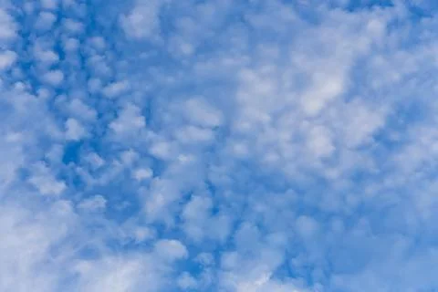 Blue clean sky with white clouds background Stock Photos
