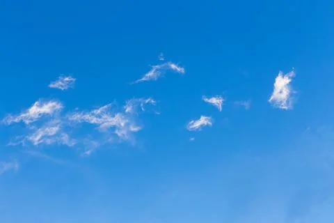 Blue clean sky with white clouds background Stock Photos