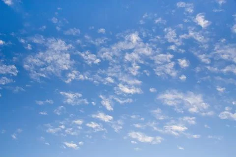 Blue clean sky with white clouds background Stock Photos