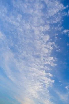 Blue clean sky with white clouds background Stock Photos