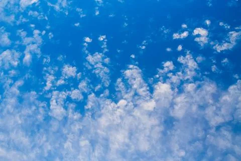 Blue clean sky with white clouds background Stock Photos