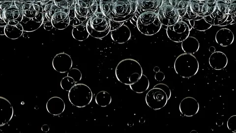 Blue Clear Bubbles Form and Float to Another Ones on Transparent Surface on Stock Footage 267965585