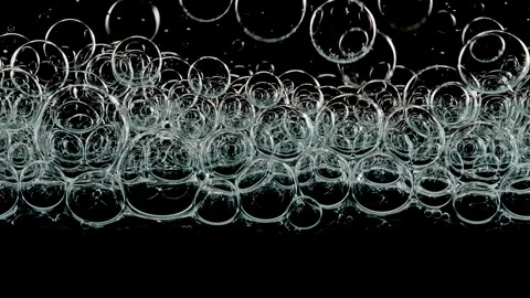 Blue Clear Bubbles Form and Float to Another Ones on Transparent Surface on Vídeo Stock 274150061