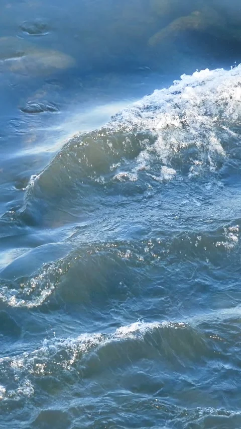 Blue clear river water flows among the rocks. A soothing landscape. Stock Footage 312141062