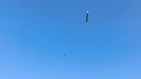 Blue Clear Sky Background Two Kites Flying at Sanur Beach Bali Stock Footage 343395110