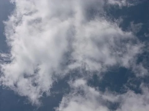 Blue clear sky background with white cloud detail Фото