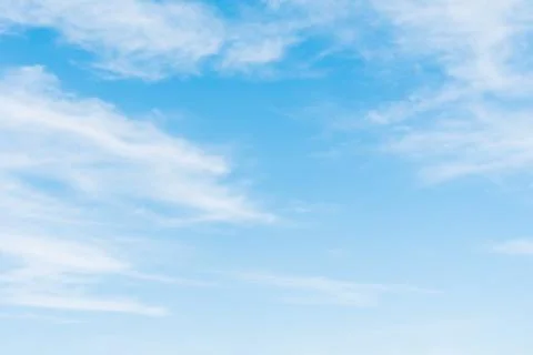 Blue, clear sky between the white clouds Stock Photos