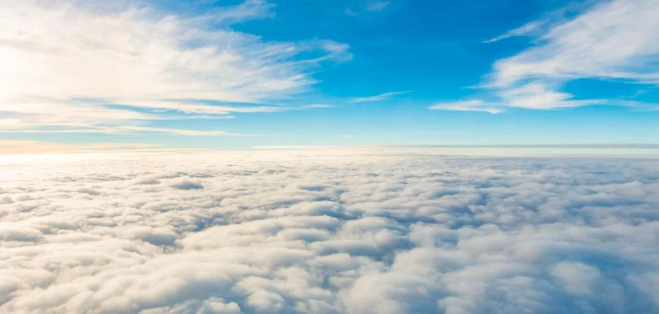 Blue, clear sky between the white clouds Stock Photos