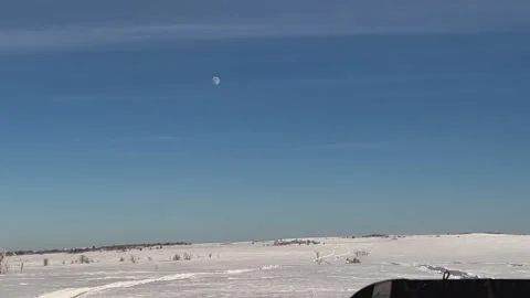 Blue clear sky over a snowy field Stock Footage 249390880
