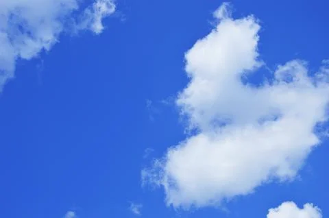 Blue clear sky with white clouds. Natural background. Stock Photos