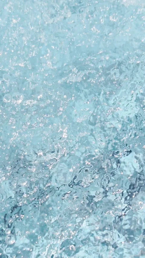 Blue clear water surface texture background with many splashes and bubbles. Vert Stock Footage 340087901