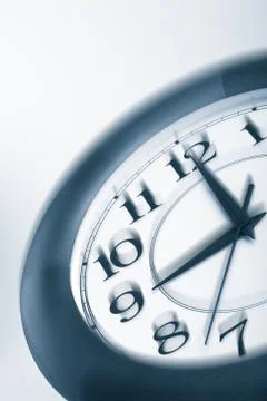 Blue clock shaking. time consept Stock Photos