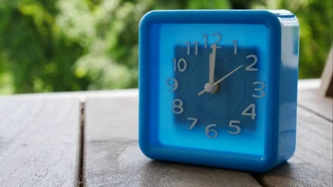 Blue clock in timelapse seen Stock Footage 78697308
