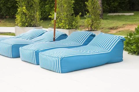 Blue cloth bed for sunbathing Stock Photos
