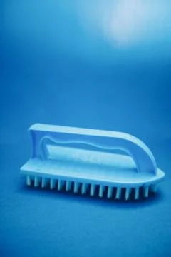 Blue clothes brush Stock Photos