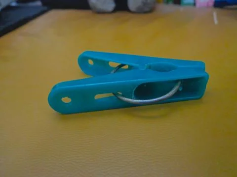 Blue clothespins Photos