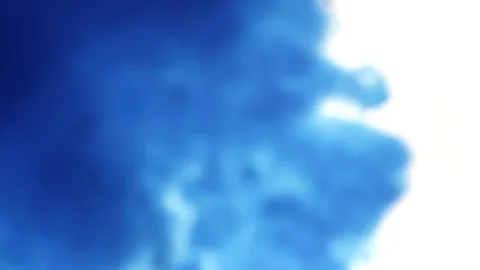 A blue cloud of ink is dropped into water then fades away Stock Footage 124789549
