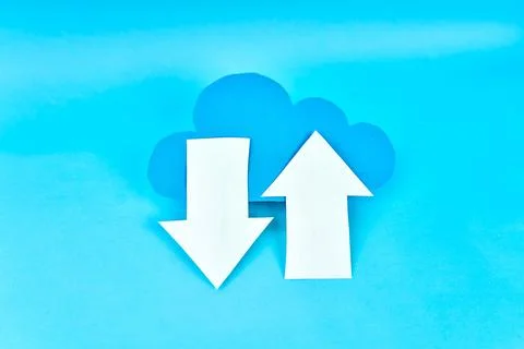 Blue cloud with white upload and download arrows on bright blue background Stock-Fotos
