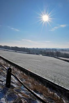 Blue cloudless sky with bright sun Stock Photos
