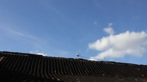 Blue clouds above the roof Stock Footage 307353783