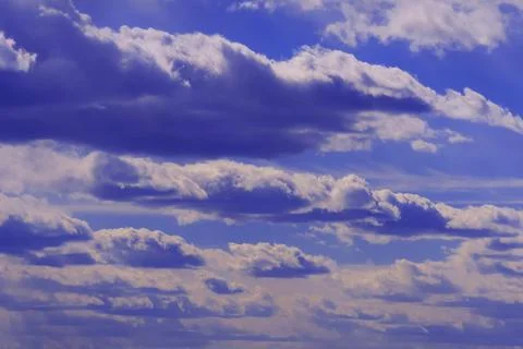 Blue clouds on a dramatic dark sky, cloudscape 写真素材