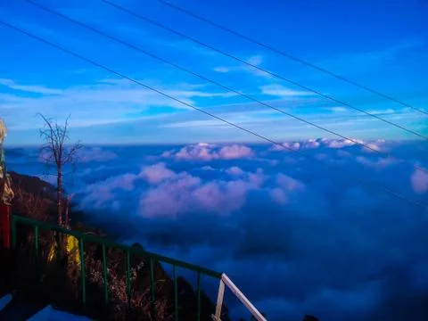 Blue clouds over mountains Stock Photos