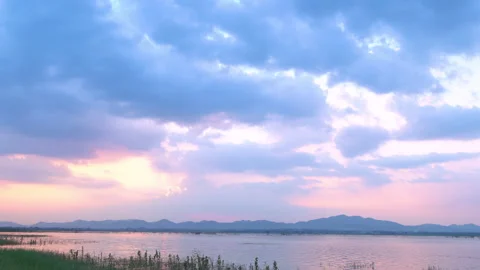 Blue clouds over reservoir Stock Footage 134310181