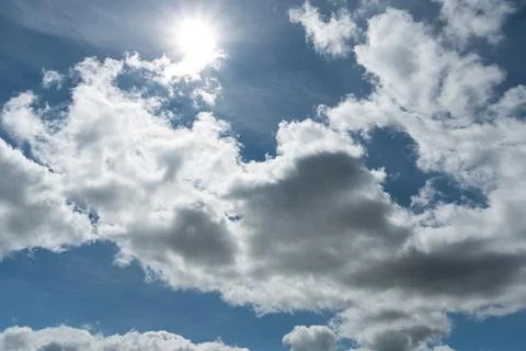Blue clouds in the sky. Warm sunny day. Stock Photos