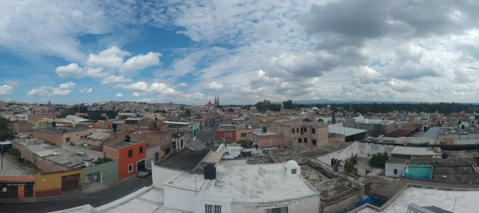 Blue clouds in small town Stock Photos