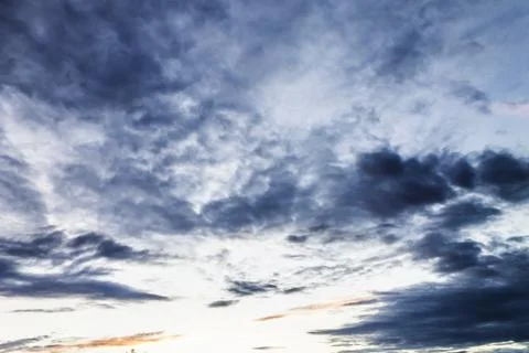 Blue clouds at sunset Stock Photos