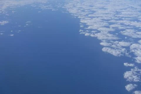 Blue cloudscape with clouds on the right side Stock Photos