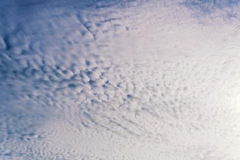 Blue cloudy sky with cirrus clouds. Ornamental clouds. Background. Fotos Stock