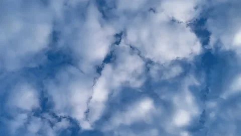Blue cloudy sky. White puffy stormy clouds on blue sky Stock Footage 131265867