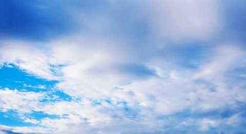 Blue cloudy sky in winter time Stock Photos